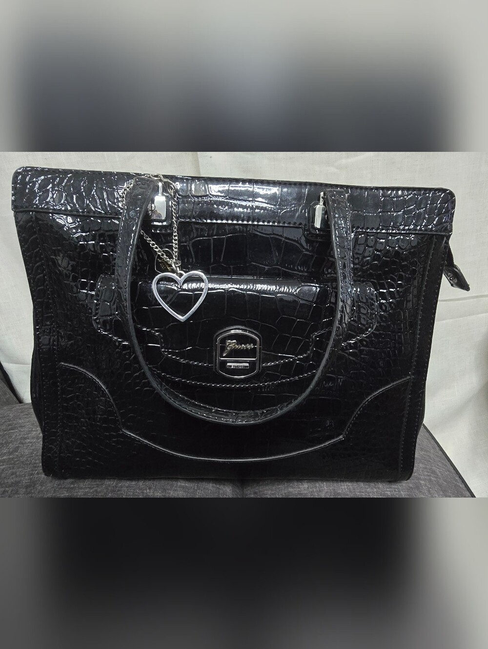 Vintage GUESS black crocodile-embossed patent leather handbag.